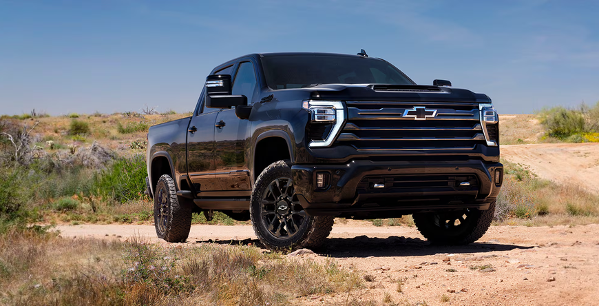 Black Chevrolet Silverado HD High Country Midnight Edition on a desert trail