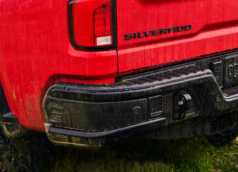 Close-up of a red Chevrolet Silverado tailgate and rear bumper