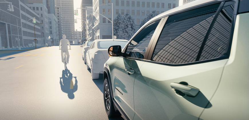 Bicyclist riding past the open door side of a parked white Chevrolet Equinox