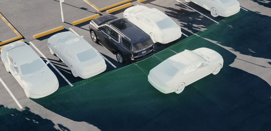 Chevrolet Tahoe backing out of a parking space with a highlighted rear detection zone