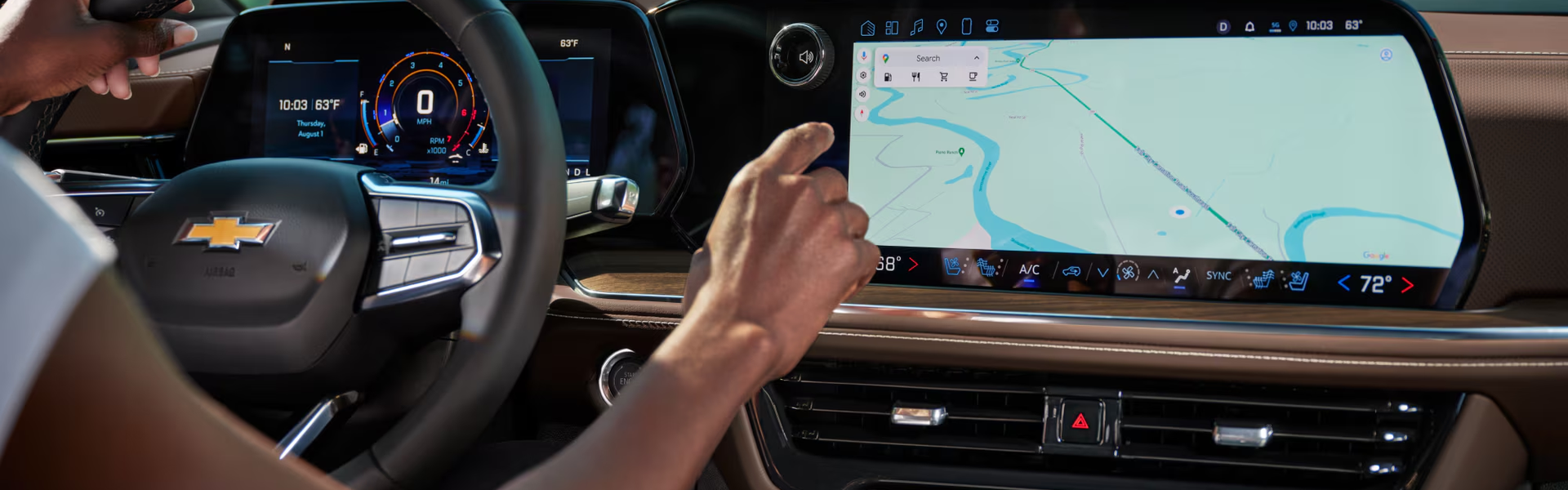 Driver touching the navigation map on the Chevrolet Tahoe's 17.7-inch center touchscreen