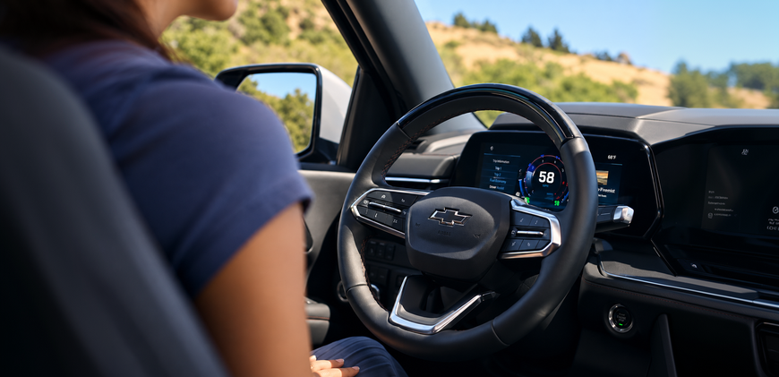 Driver cruising hands-free with Super Cruise in a Chevrolet Tahoe on an open highway