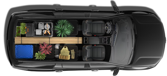 Overhead cutaway of a Chevrolet Traverse packed with lumber, paint cans and potted plants