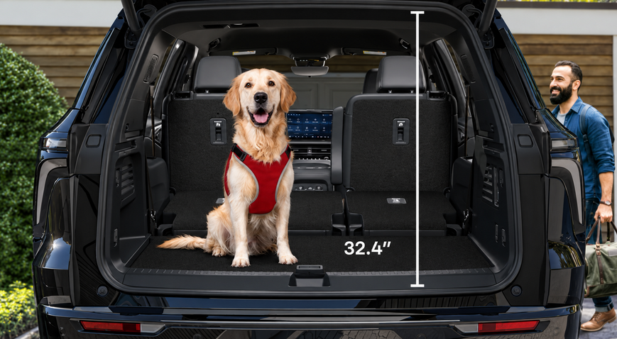 Golden retriever sitting in the Chevrolet Traverse cargo area with its 32.4-inch height marked