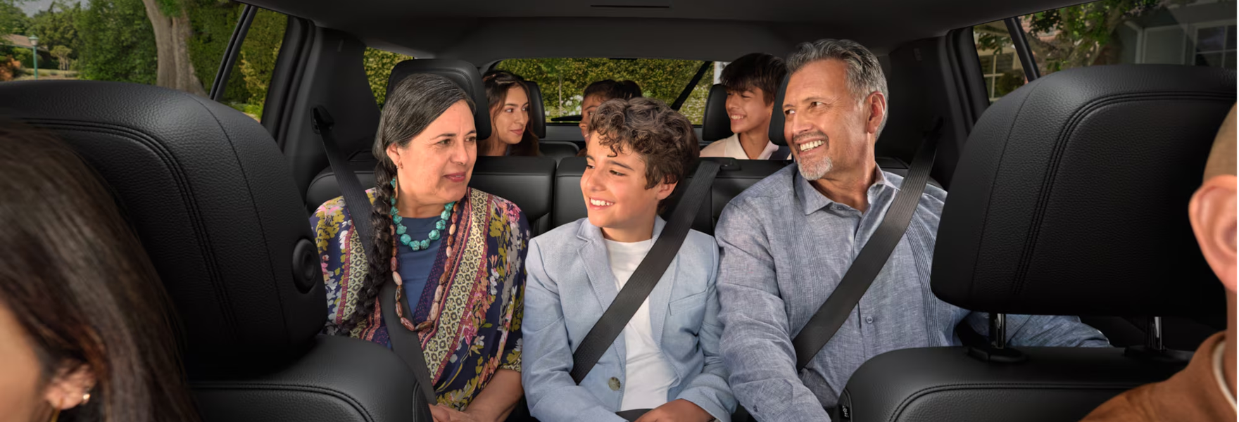 Family riding together in the rear seats of a Chevrolet Traverse
