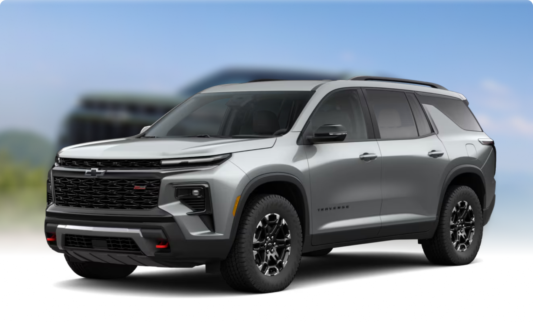 Silver 2027 Chevrolet Traverse Z71 in front of a soft-focus blue sky