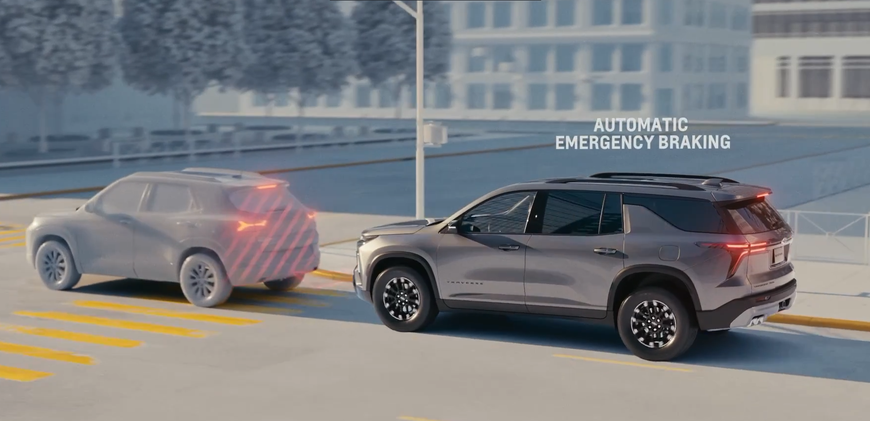 Chevrolet Traverse braking behind another SUV with an Automatic Emergency Braking alert