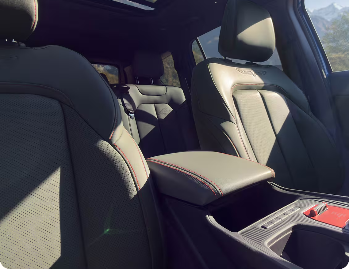 Black leather front seats and center console of the 2027 Jeep Cherokee