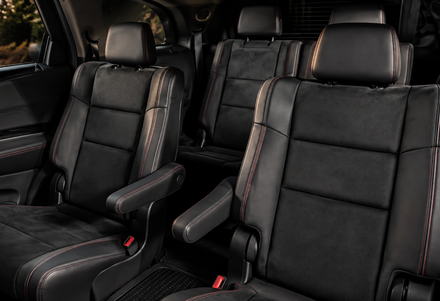 Black leather second-row captain&rsquo;s chairs and third-row seating in a Dodge Durango