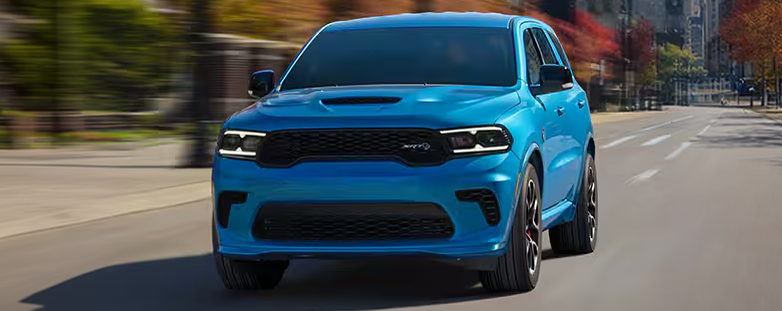 Blue Dodge Durango SRT driving down a city street