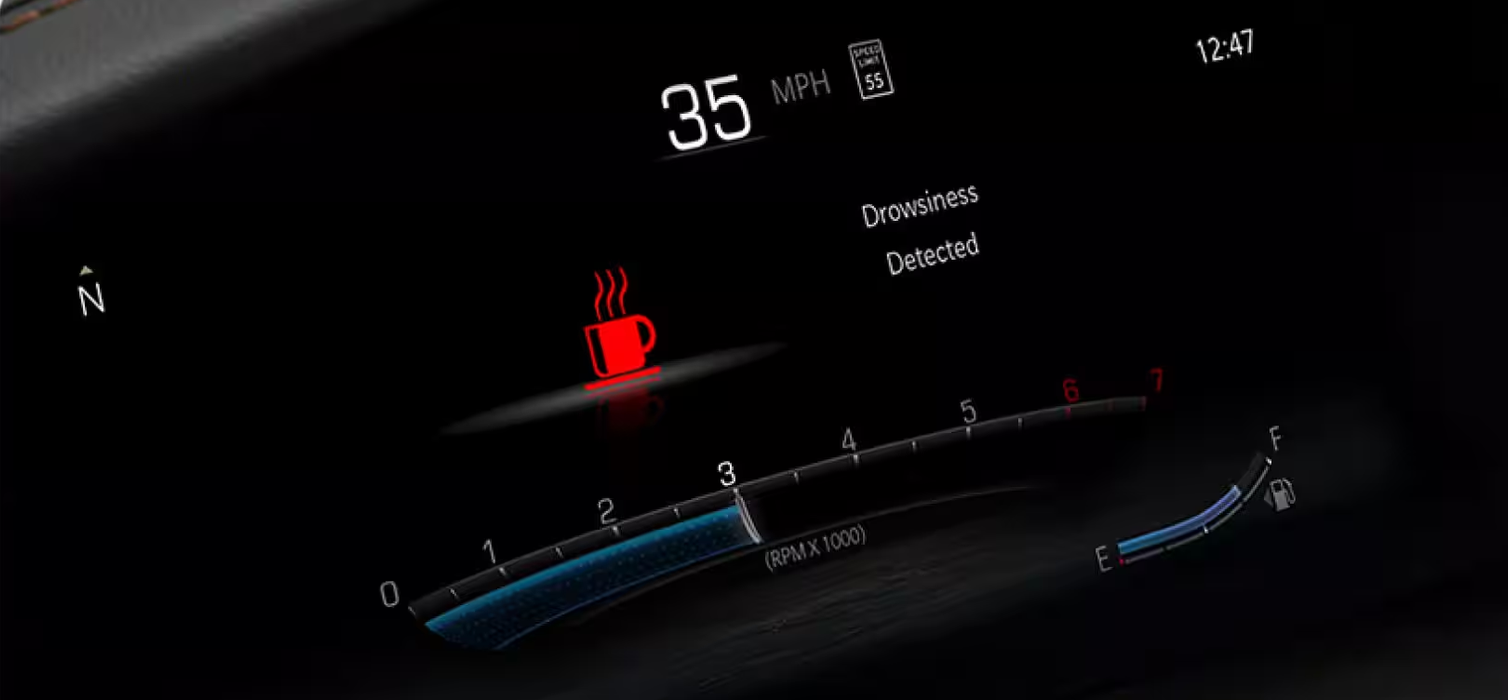 Digital cluster displaying a drowsiness detected alert