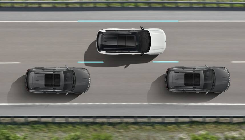 Overhead illustration of a Grand Cherokee centered in its highway lane