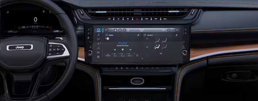 Grand Cherokee dashboard with the steering wheel and Uconnect touchscreen