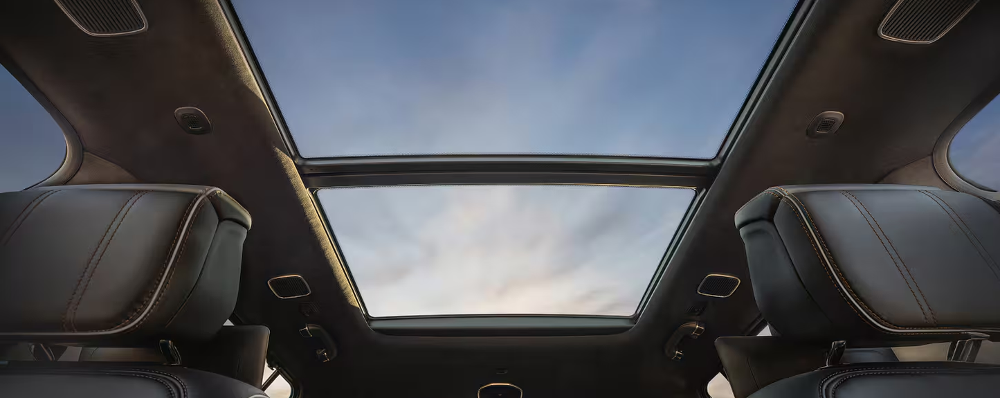 Tri-Pane Panoramic Sunroof open above the cabin