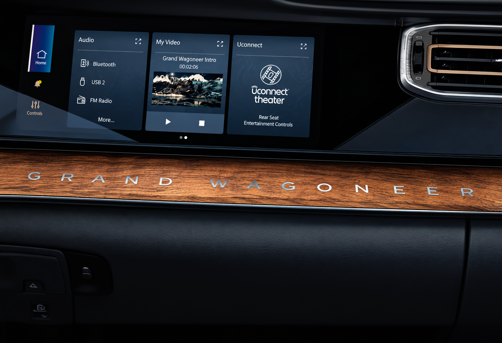 Dashboard screens above a grained walnut trim panel engraved Grand Wagoneer
